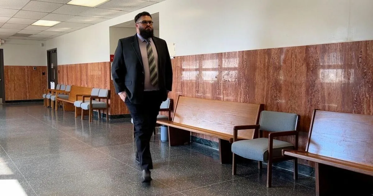 A former Bonner Springs police detective leaves Wyandotte County courthouse after a hearing