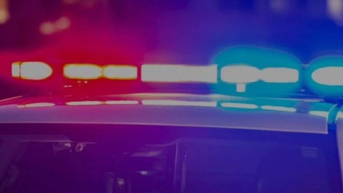 Police and fire crews at a crash scene at a Lapeer County intersection