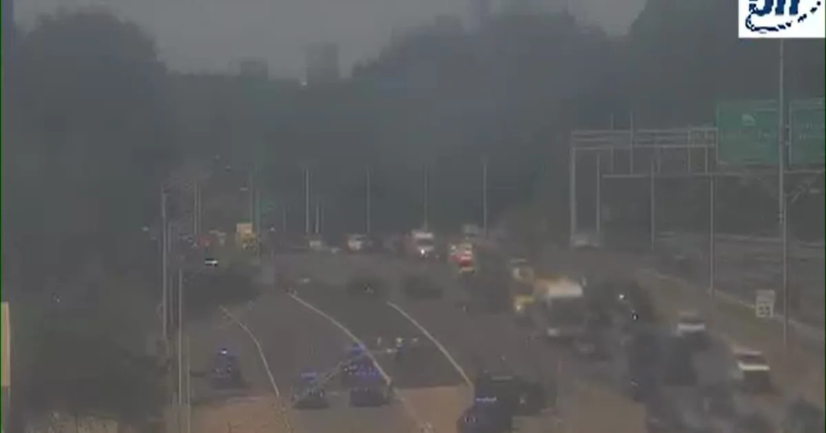 Georgia State Patrol trooper vehicle near a highway crash scene on Interstate 75 South