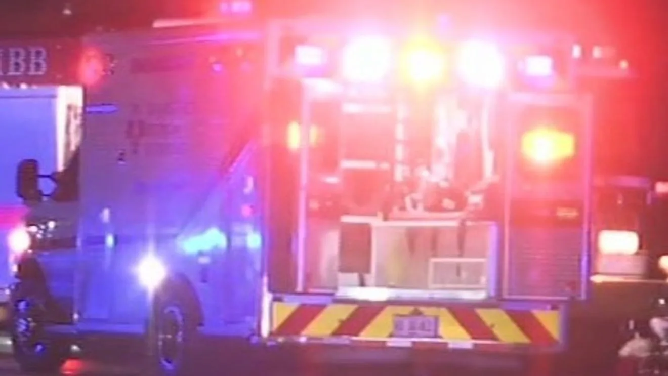 Police investigate a fatal motorcycle crash where an SUV caught fire at an intersection in Baldwin County, Georgia