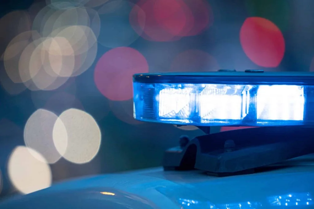 A damaged Pontiac at the scene of a fatal rollover crash on a rural South Dakota road