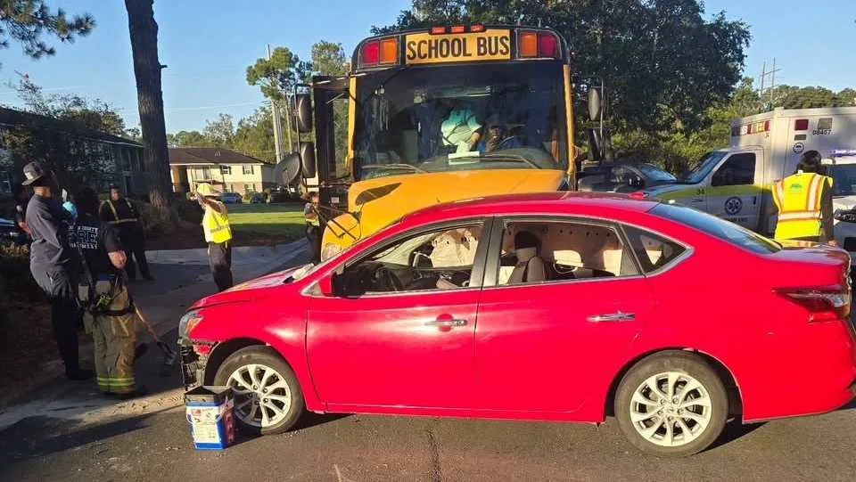 Emergency crews respond to a school bus crash on King George Boulevard in Chatham County