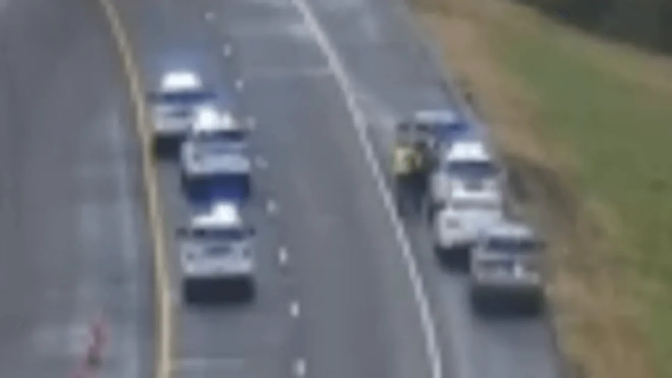 Traffic cones and stopped vehicles blocking a closed interstate near Nashville