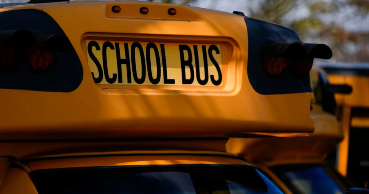 School bus crash scene in Harlan County with emergency response vehicles nearby