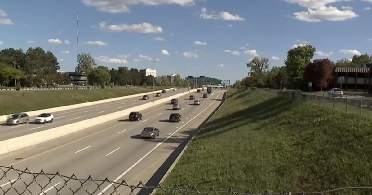 Police investigate a deadly crash scene on the Lodge Freeway in Michigan