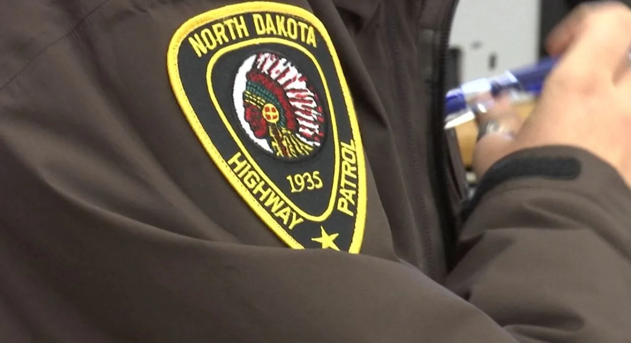 A motorcycle crash investigation near a rural highway and interstate fence line